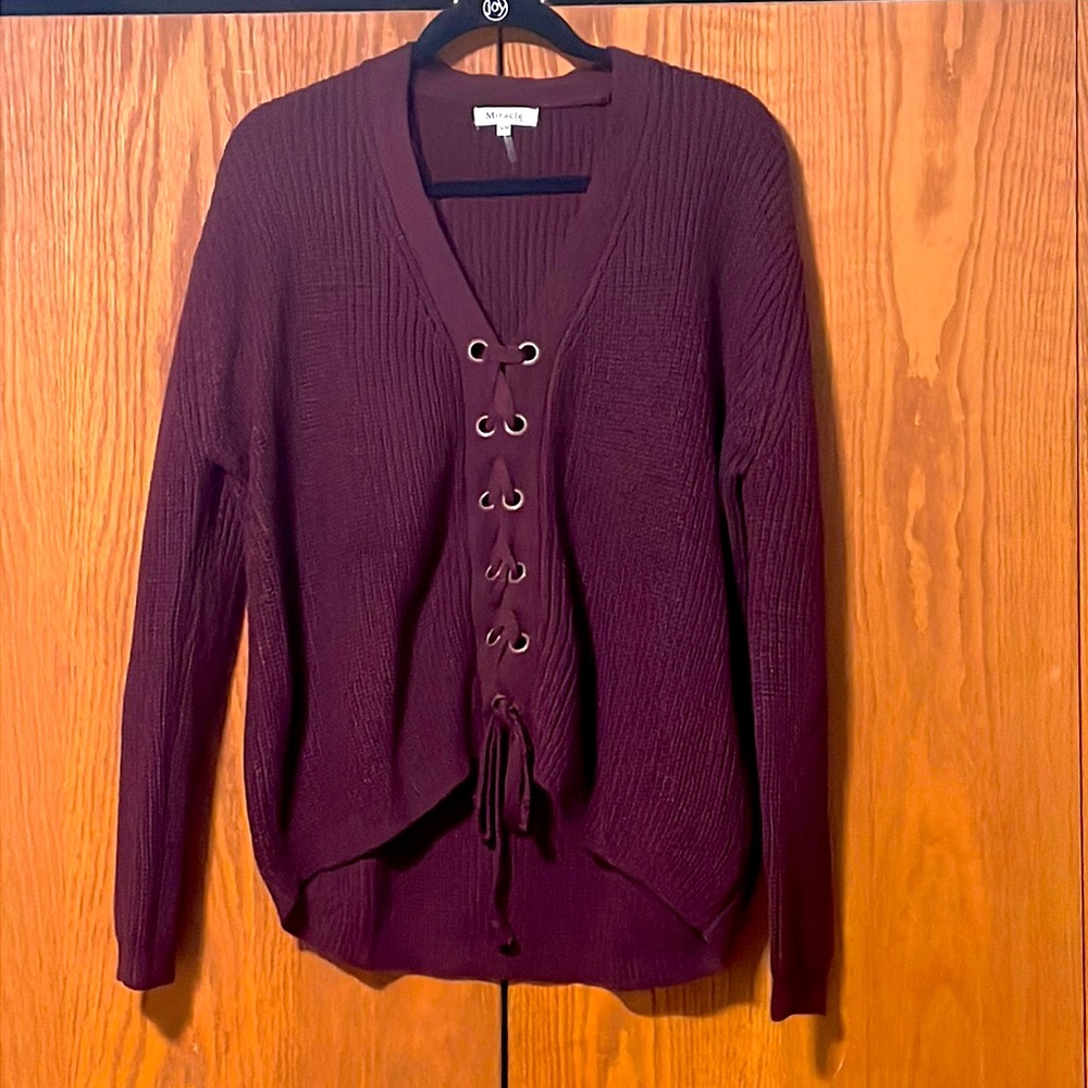 New without tags. Size S/M. Rich purple color with adorable lace up detail.